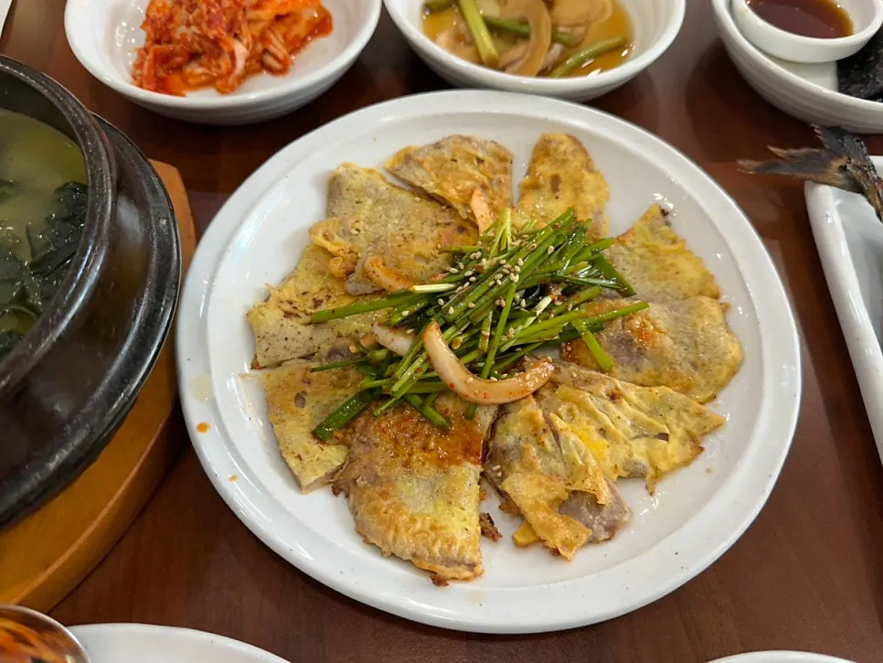 Large grilled mackerel served whole