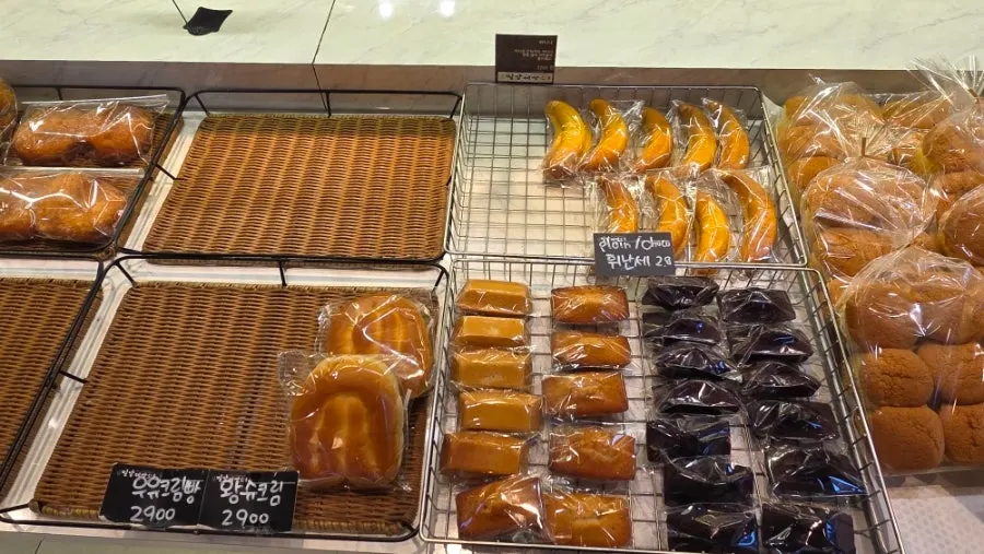 Bread display shelves inside Milbat Bakery Pyeongchon