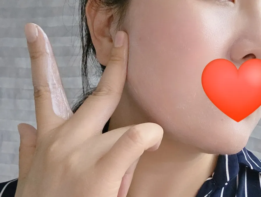 Large-volume sunscreen applied generously to neck and arms