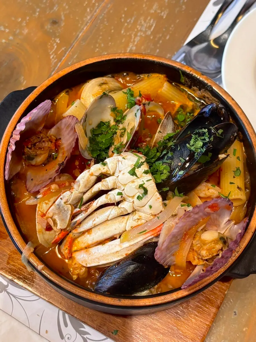 Twirled noodles of the pesce tomato seafood pasta