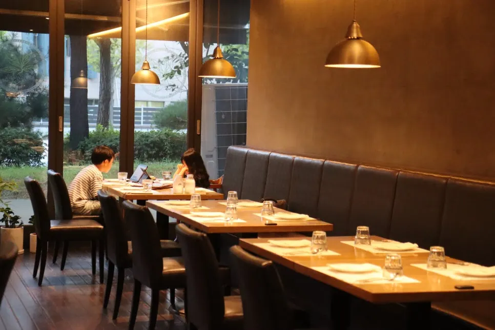 Soft lighting illuminating tables inside the hall