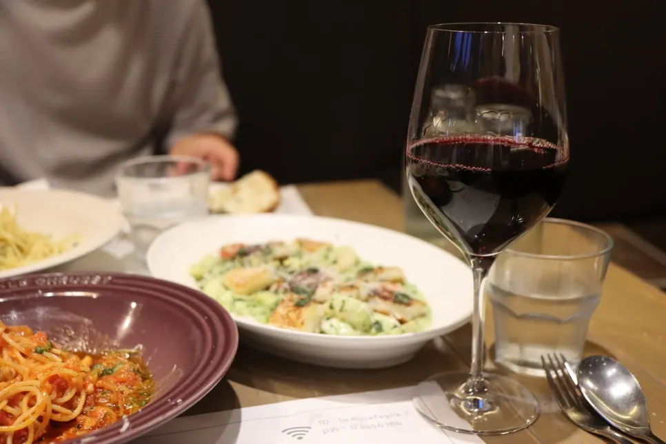 Dinner table with a glass of wine to finish the meal