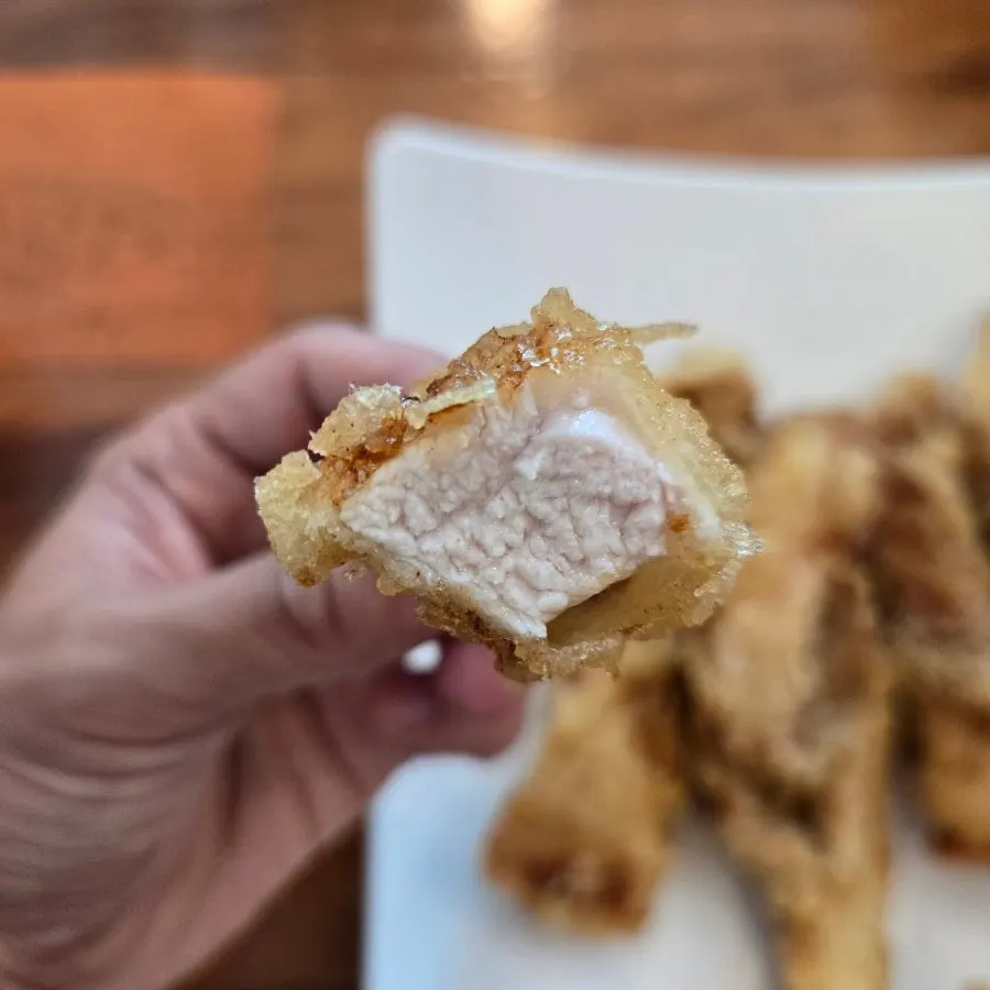 Crispy tangsuyuk dipped in sauce