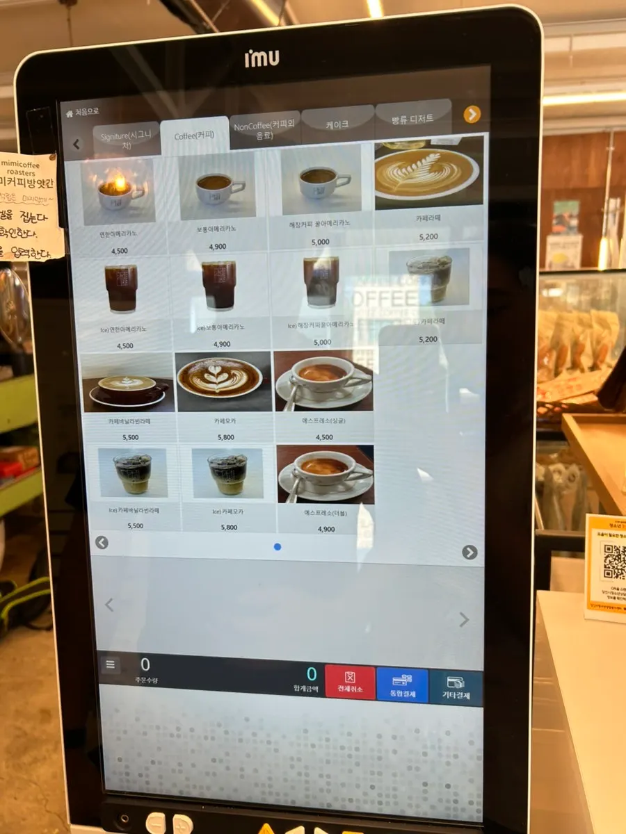 Coffee menu board at MIMI Coffee Mill