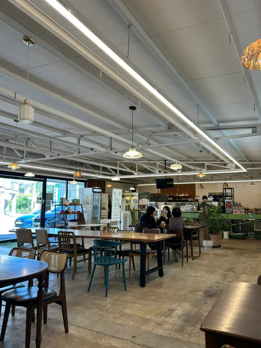 Customers seated in the main hall at MIMI Coffee Mill