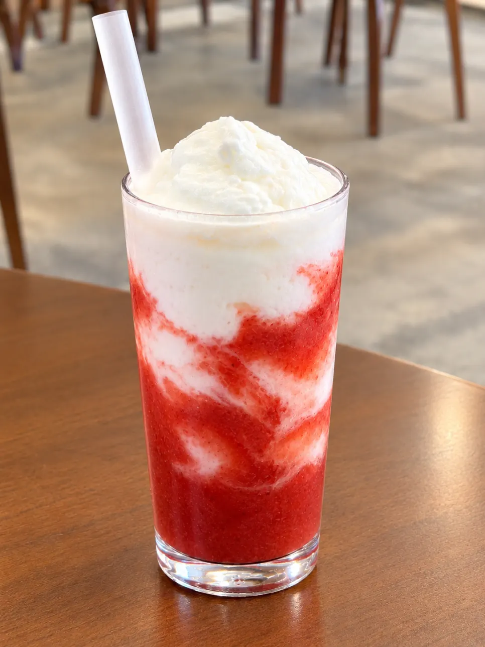 Yogurt strawberry smoothie with visible strawberry chunks