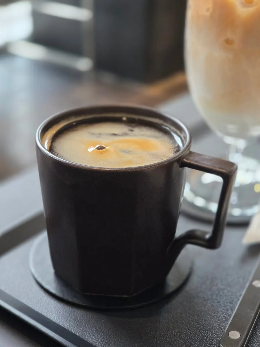 Helsinki latte and decaf americano together