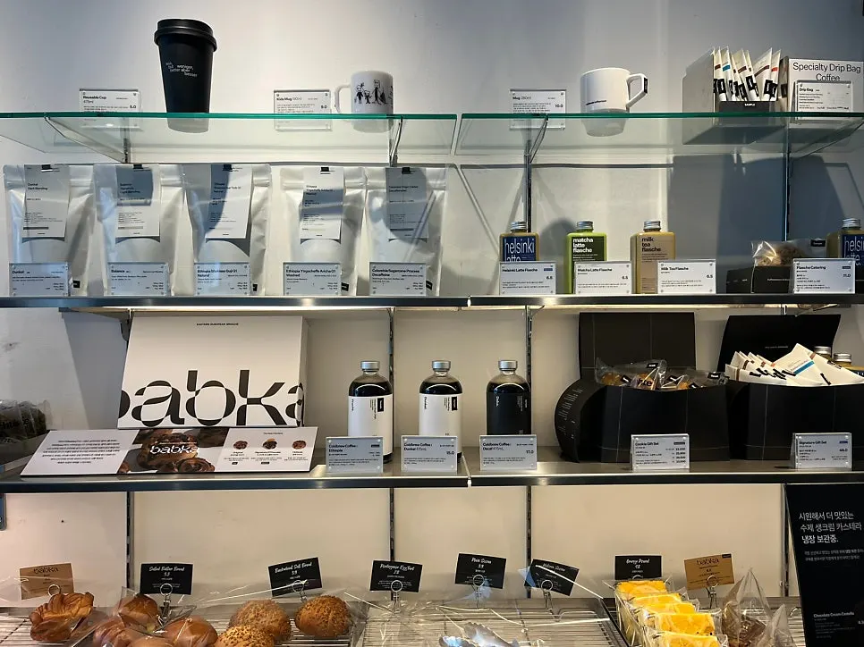 Display of Mini Male bottled lattes and tumbler merchandise