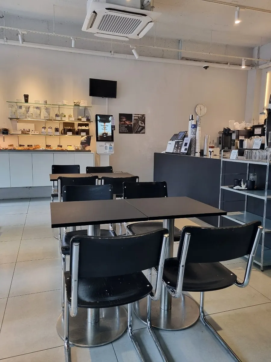 Spaciously arranged tables inside the café