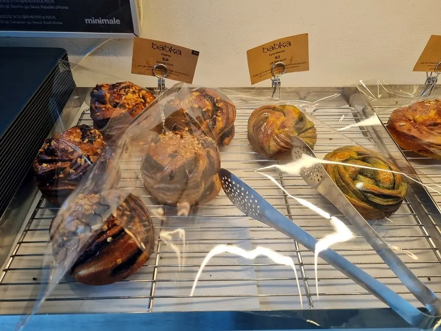 Display cabinet with coffee beans, coffee concentrate, and goods
