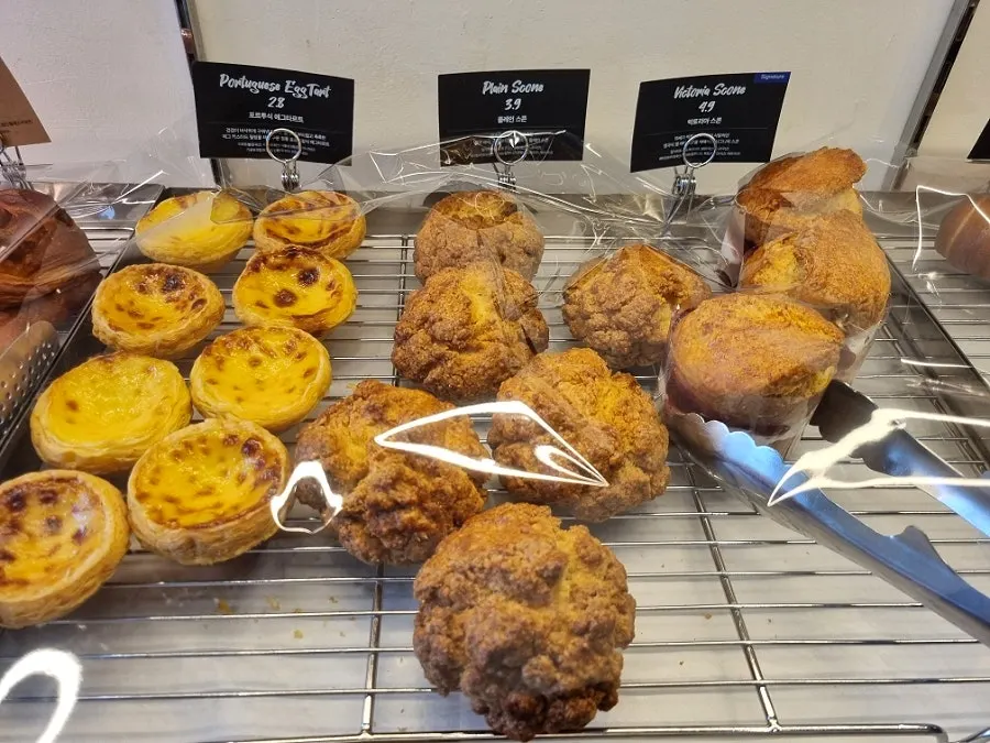 Various types of bread on the café display counter