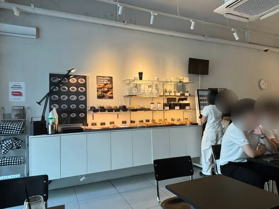 Busy café scene during post-meal coffee hour