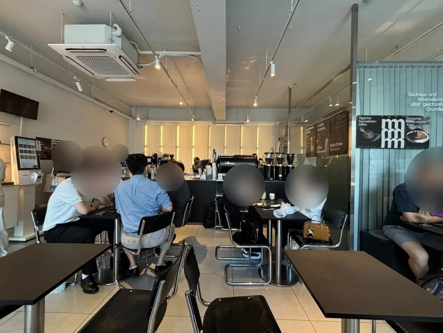Clean black-and-white toned café atmosphere