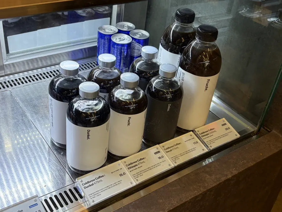 Bottled cold brew displayed under the counter