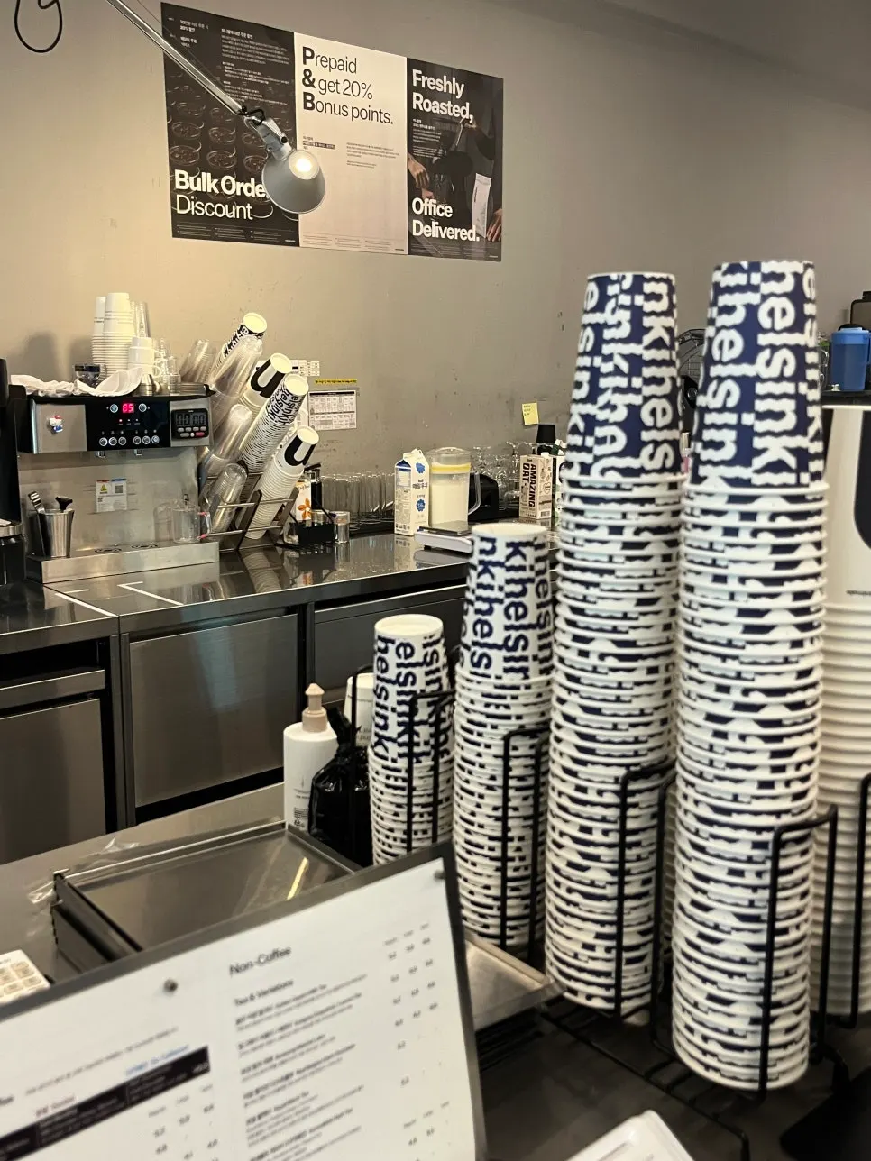 Shelf with coffee bean packages and souvenirs
