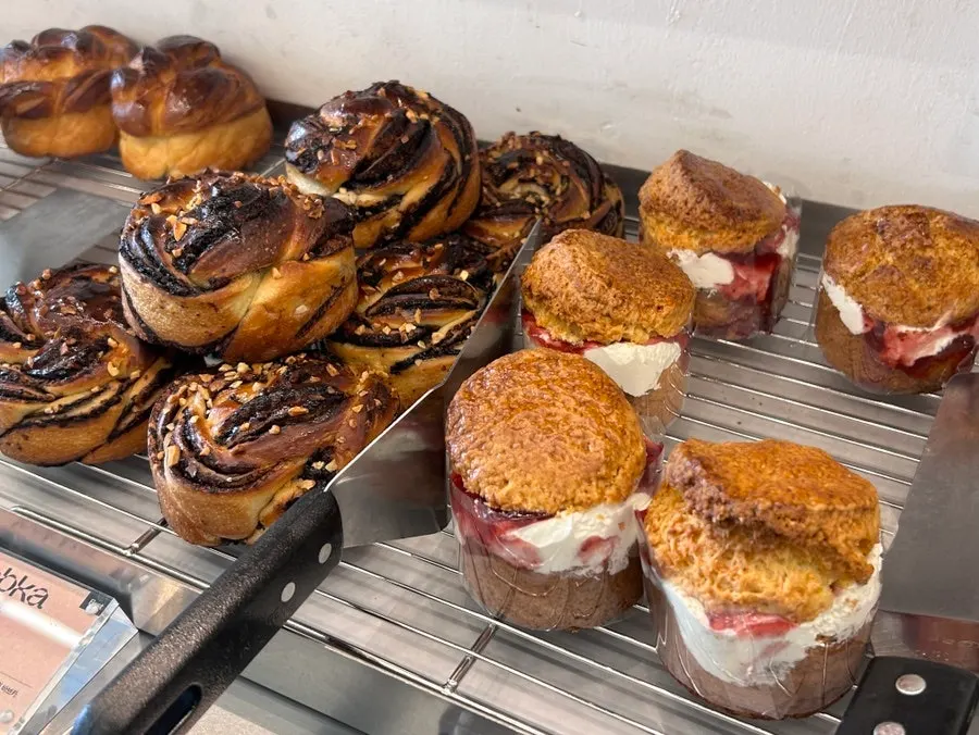 Dessert display case with scones and cookies