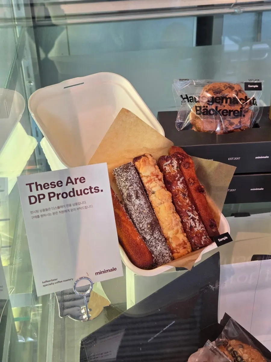 Various financier flavors including plain and lamington on display