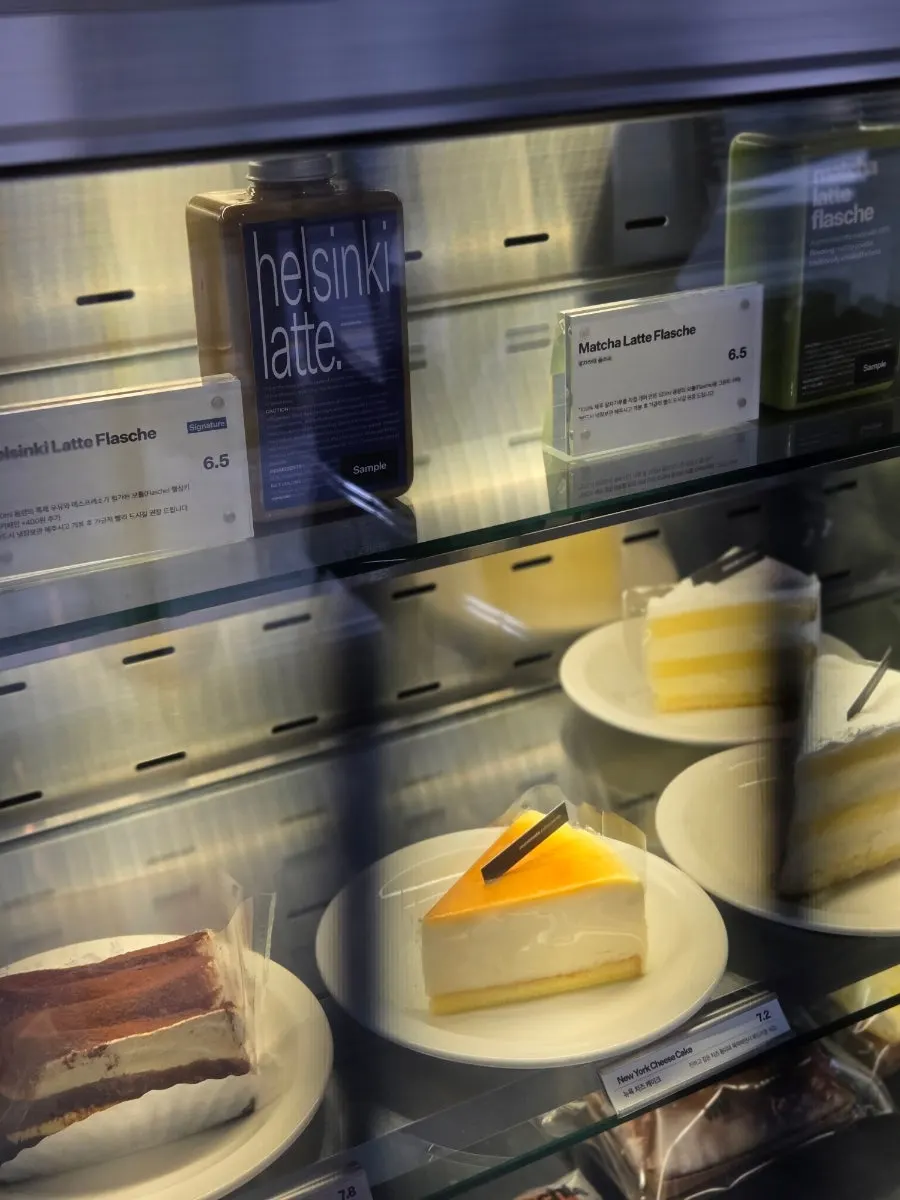 Cakes, castella, and tiramisu displayed in the fridge