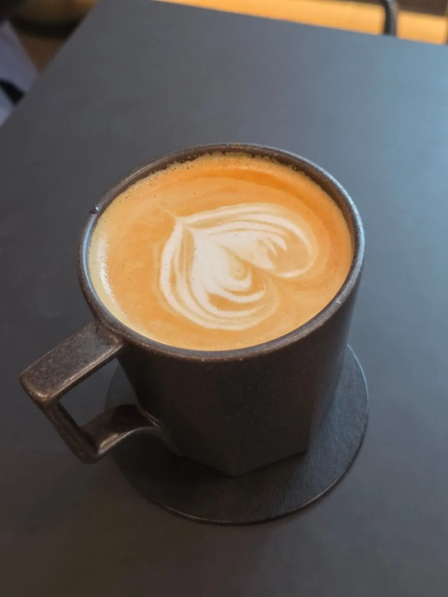 A cup of Mini Male's Helsinki latte