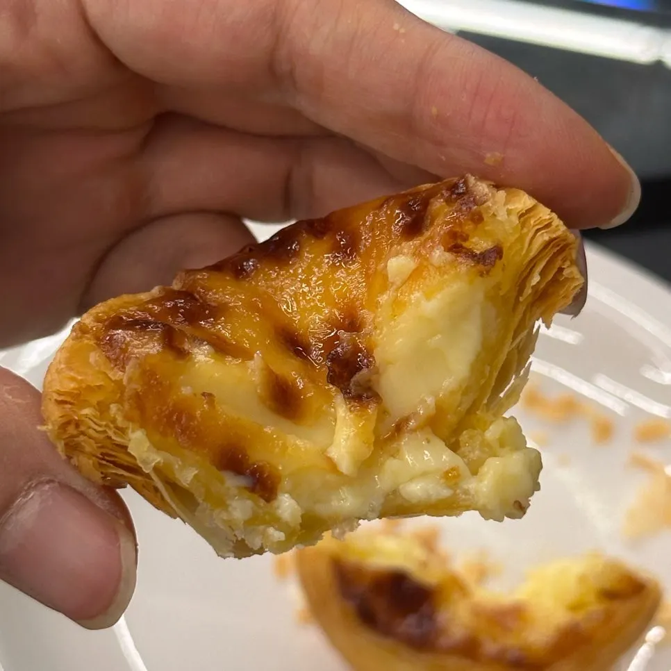 Cross-section of egg tart showing moist egg filling