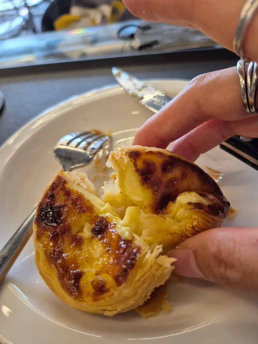 Egg tart served alongside coffee