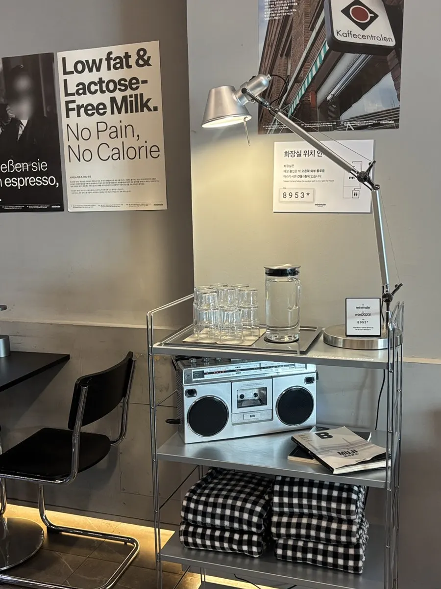 Café seating area with blankets and bottled water ready