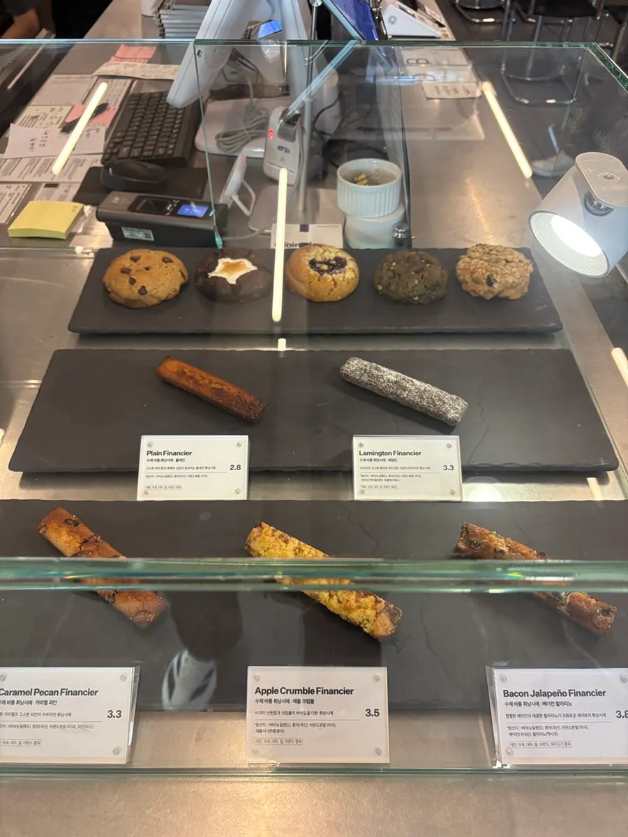 Displayed coffee bean packages and gift-wrapped cookies