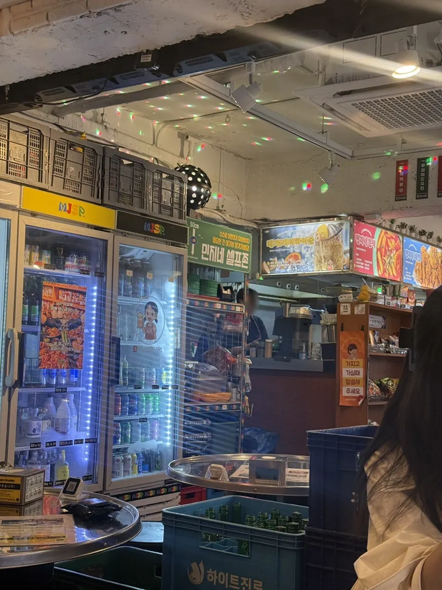 Overview of the pojangmacha-style main hall at Minji Superette