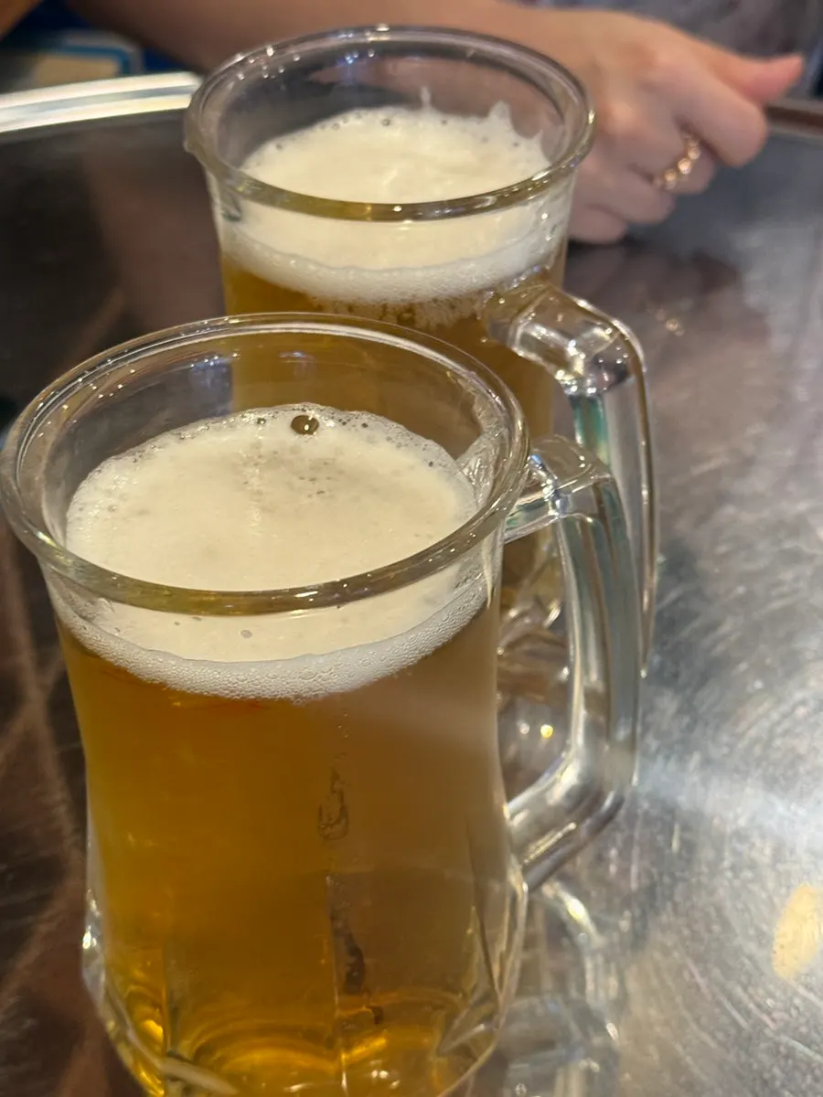 A draft beer glass set among retro decor items
