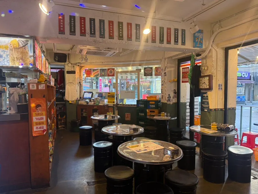 Seating layout at Minji Superette extending to group tables