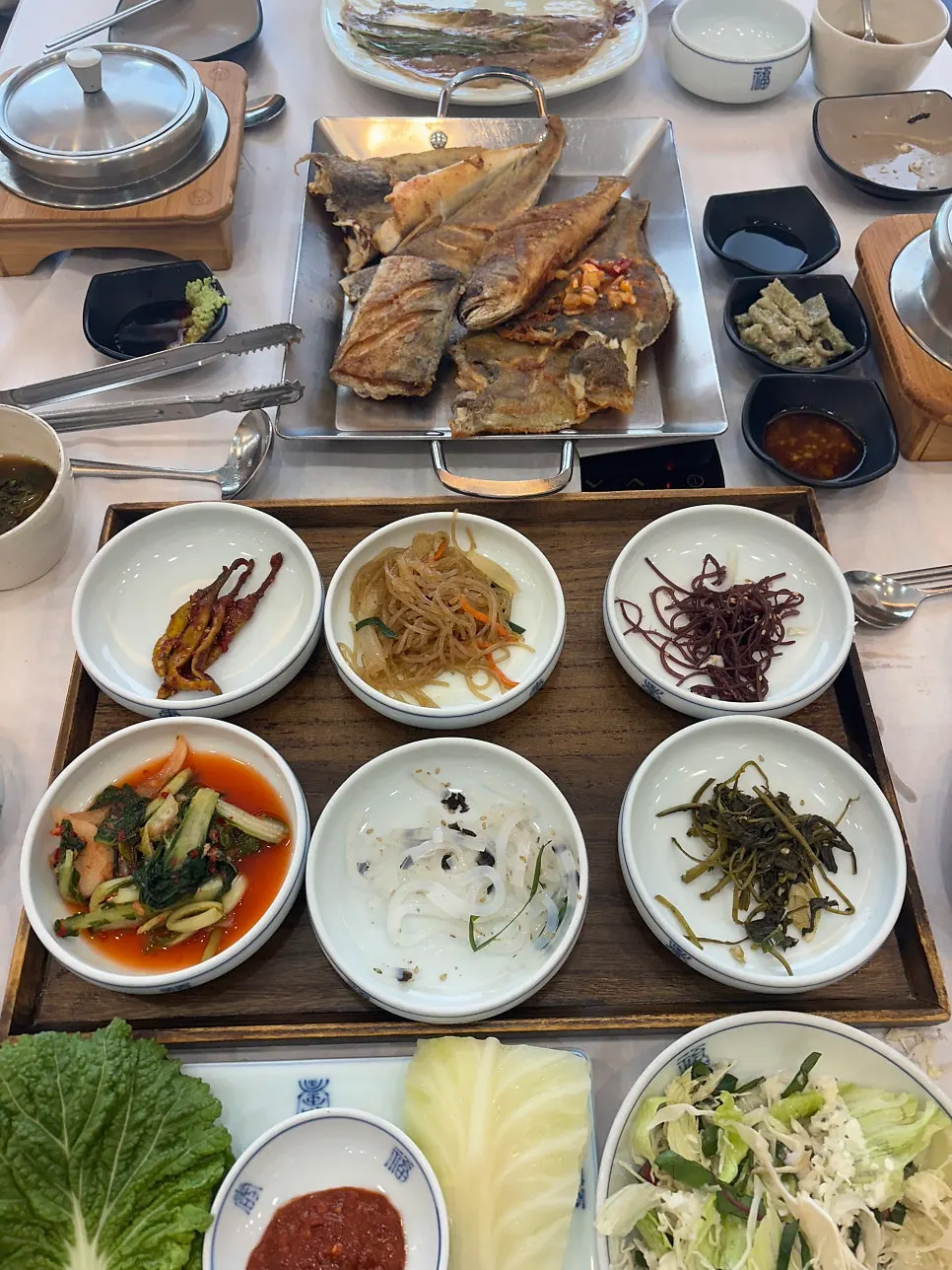 Full table setting of the seasonal grilled fish set for 3
