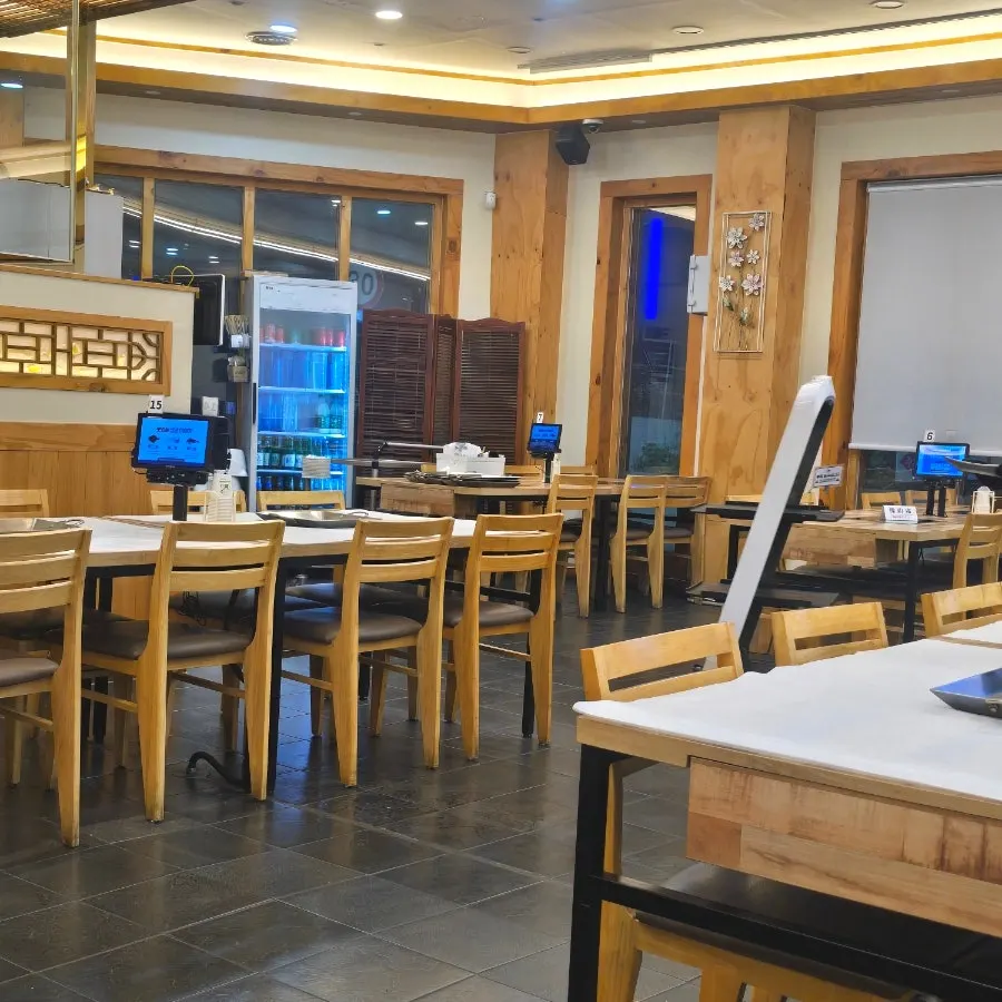 Spacious, comfortable seating inside the Min Cook Apbadang Seongsa Korean restaurant