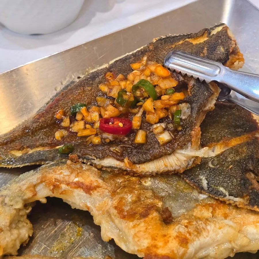 Grilled flounder brushed with spicy sauce