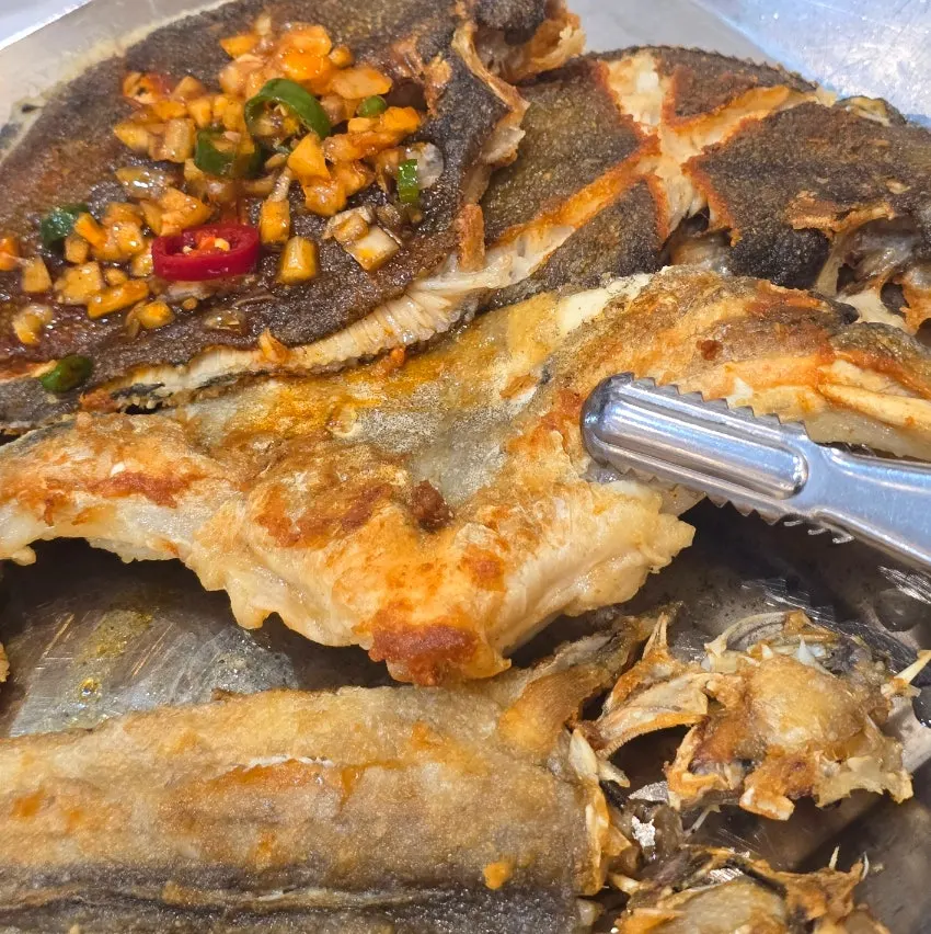 Grilled cod cheek with a large bone