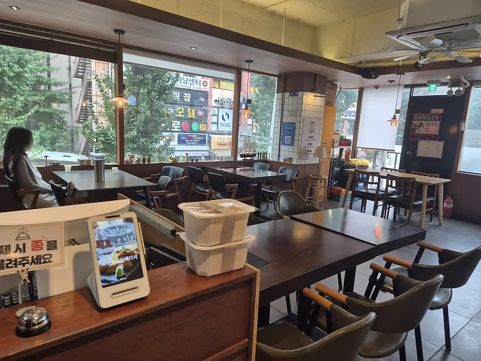 Min Cook Dasima's counter and wood-toned main hall
