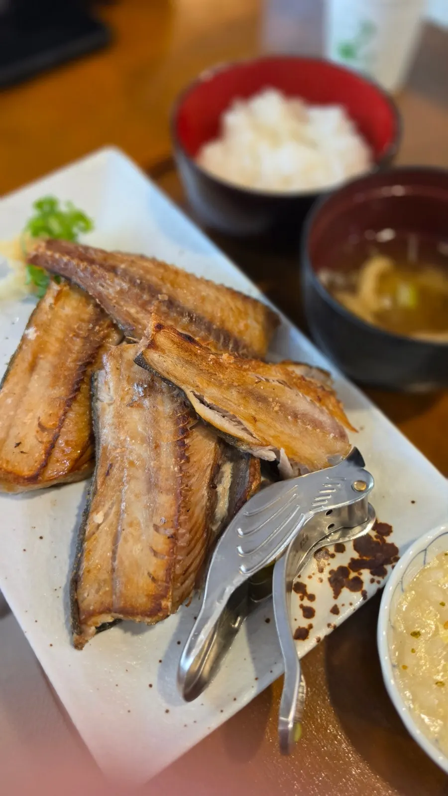 Table setting with extra-large miso-grilled mackerel half portion