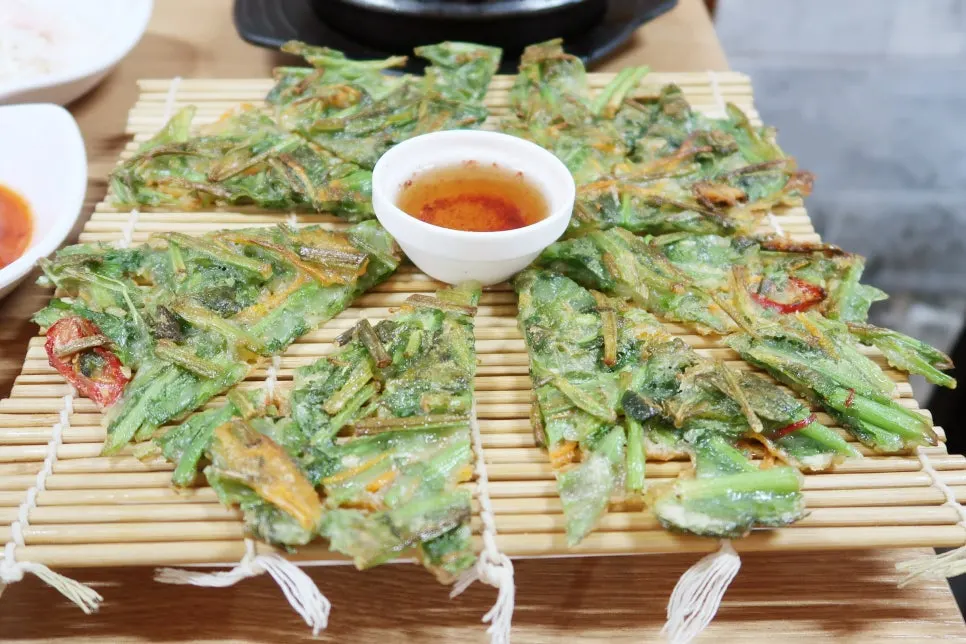 Minari pancake packed with minari, served with dipping sauce