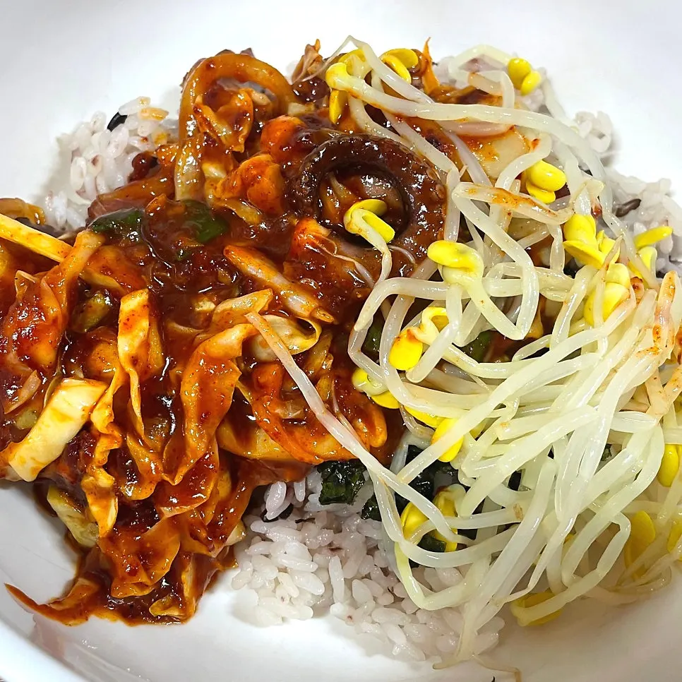 Mixing octopus bokkeum with rice and gim