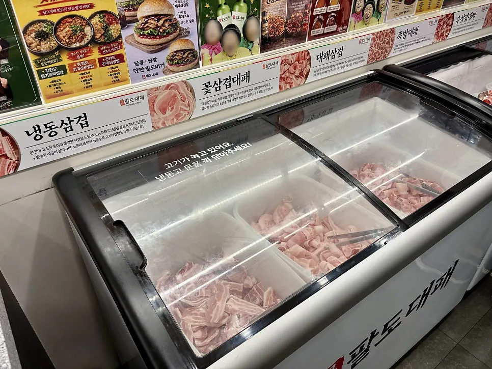Menu board showing the ₩18,900 premium unlimited daepae
