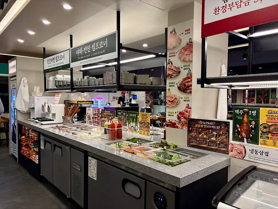 Sign listing prices for pot rice and unlimited soju