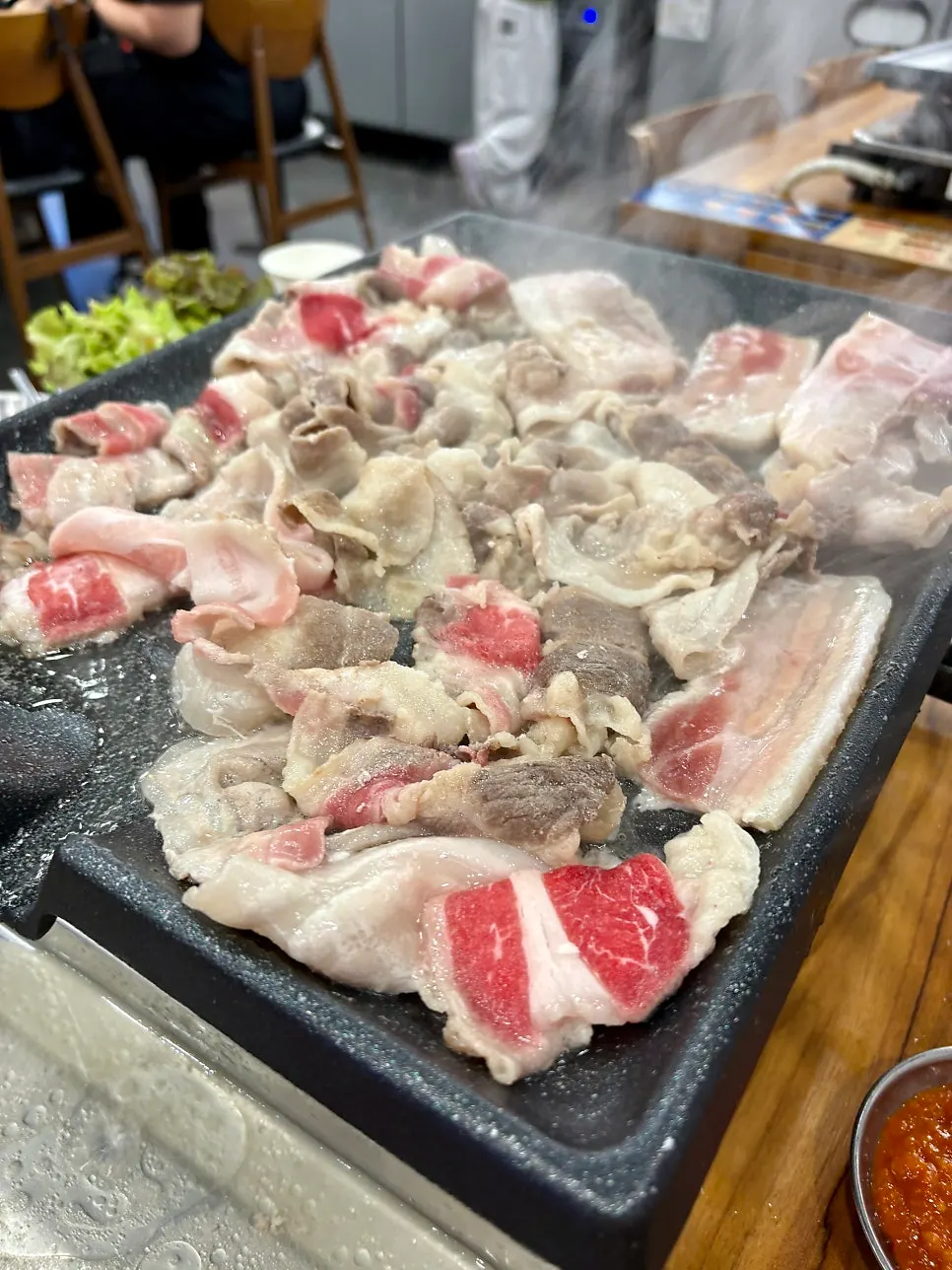 Mushrooms and kimchi grilled together on the pan