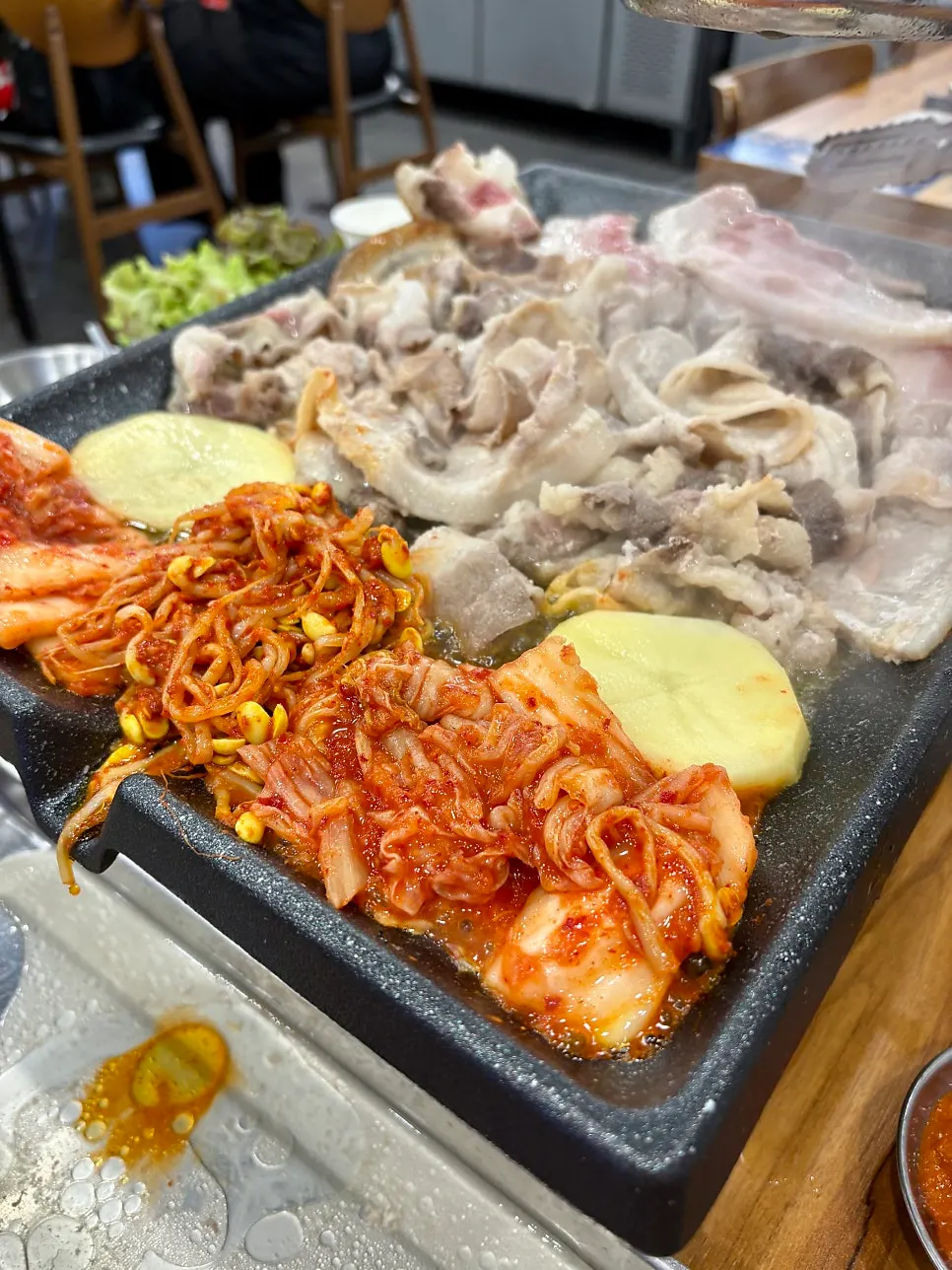 Plate of thin-sliced meat brought over from the all-you-can-eat bar