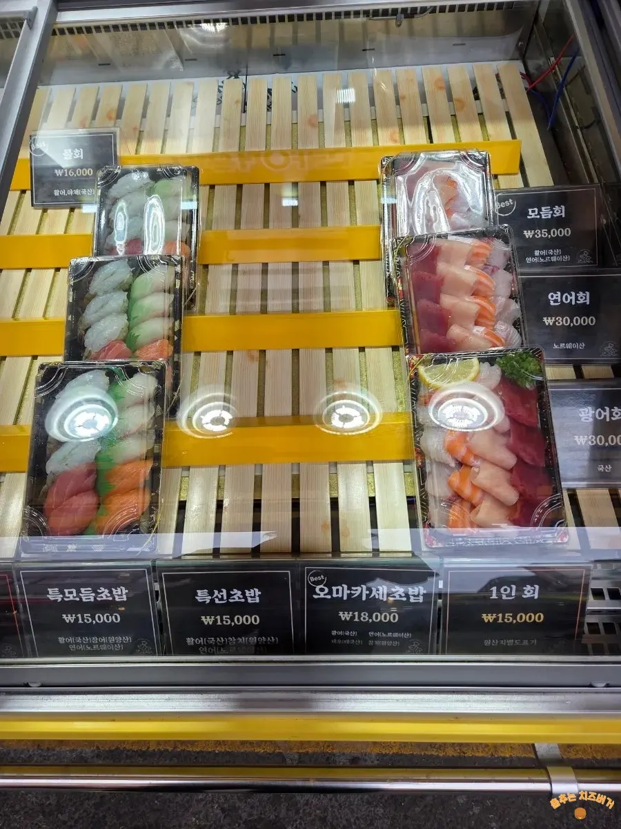 Vertical sushi menu sign on the wall