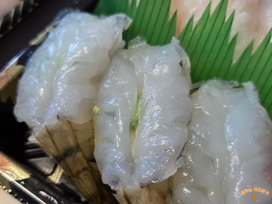 Sushi box with white fish and various other sushi types