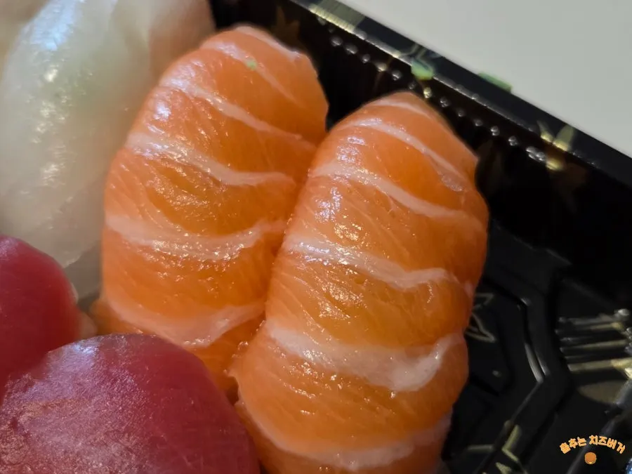 Sashimi and sushi laid out together at home