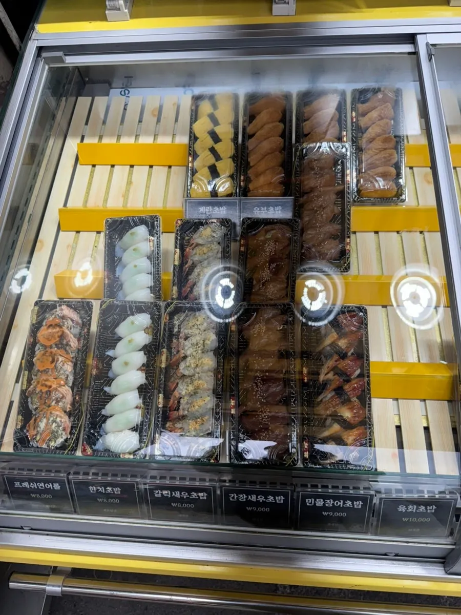 Refrigerated showcase of sushi at Minyeong Hwareo Gongjang