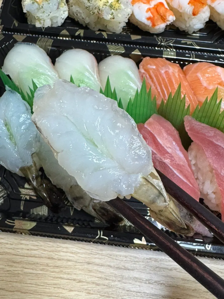A piece of sushi showing the fish-to-rice ratio