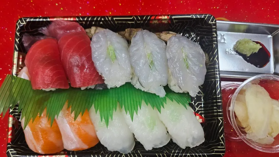 Special assorted sushi with flounder, salmon, raw shrimp, and akkami