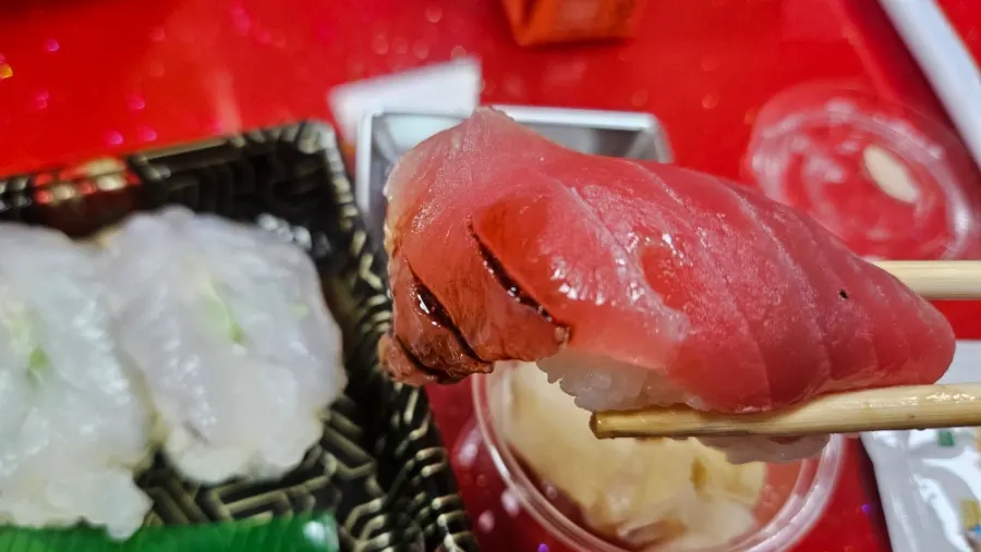 Close-up of the deep-colored akkami sushi