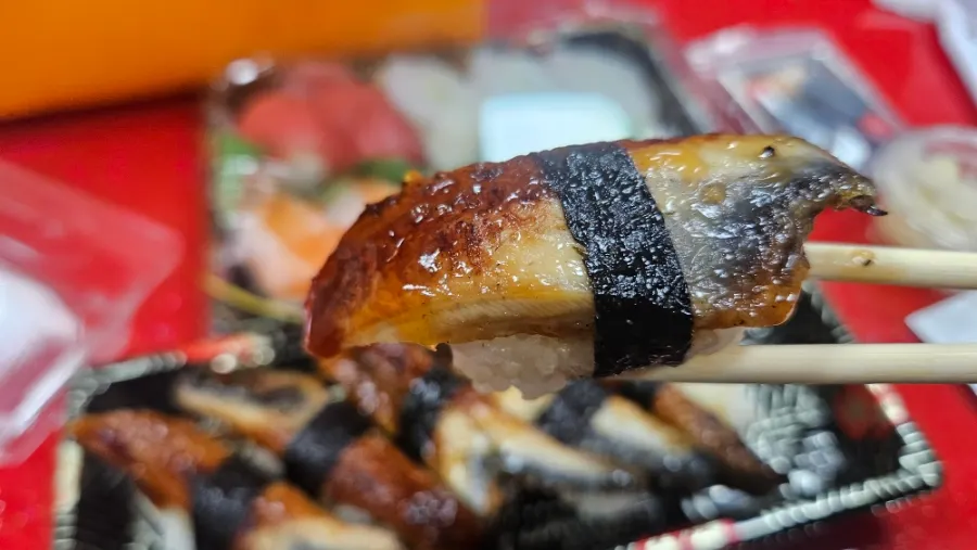 Close-up of a single piece of freshwater eel sushi